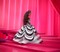 Barbie Signature Doll, 65th Anniversary Collectible with Brown Braided Hair, Black & White Gown, Sapphire Gem Earrings & Sunglasses